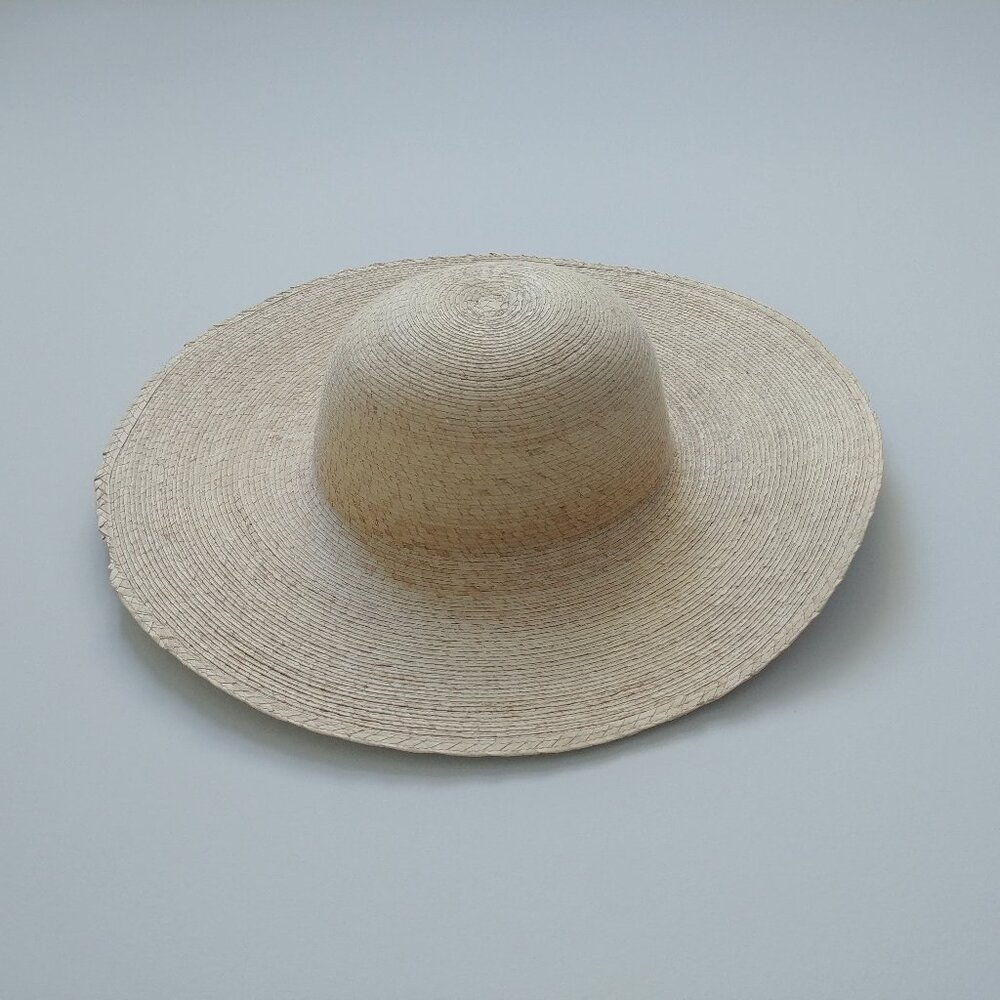 Neutral straw summer sun hat with very wide brim